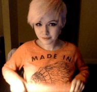 Adorable pale teen with cute smile flashing webcam